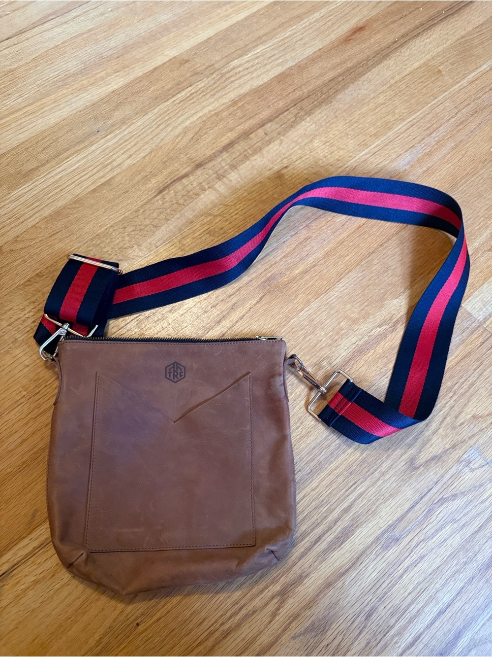 The Root Collective Crossbody Bag with Navy and Red fabric detachable Strap